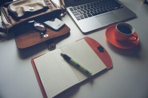 desk and computer with coffee